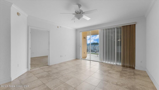 empty room featuring ornamental molding and ceiling fan