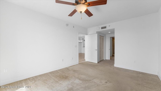 carpeted empty room with ceiling fan