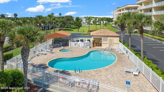 view of swimming pool featuring a patio