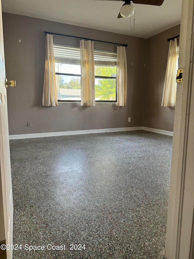 empty room featuring ceiling fan