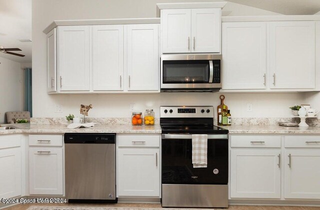 kitchen with white cabinets, ceiling fan, and appliances with stainless steel finishes