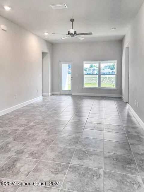 1182 Tupelo Cir, Cocoa, FL 32926 - tiled empty room featuring ceiling fan, baseboards, and recessed lighting