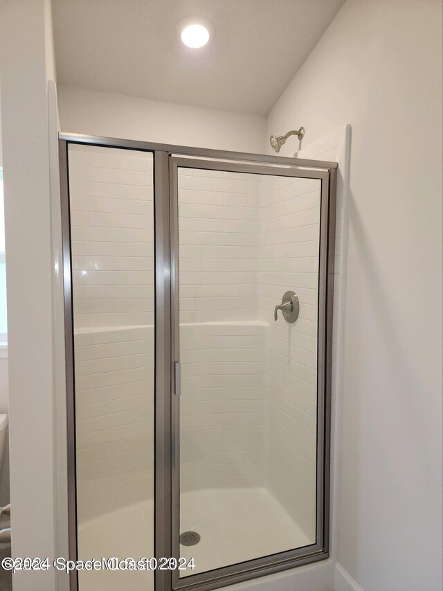 1182 Tupelo Cir, Cocoa, FL 32926 - bathroom featuring a shower stall and toilet