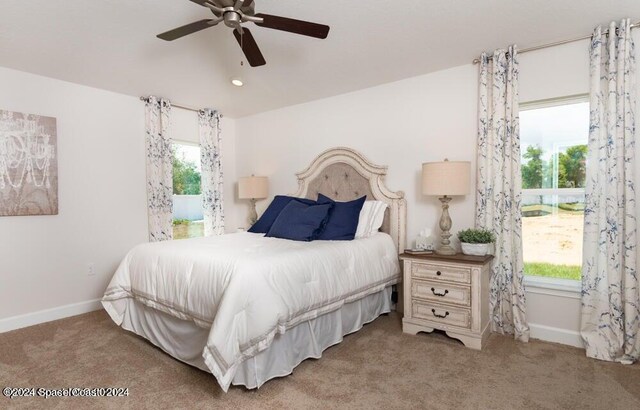 1182 Tupelo Cir, Cocoa, FL 32926 - carpeted bedroom with multiple windows, baseboards, and a ceiling fan