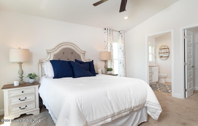 1182 Tupelo Cir, Cocoa, FL 32926 - bedroom with light carpet, ensuite bathroom, lofted ceiling, ceiling fan, and baseboards