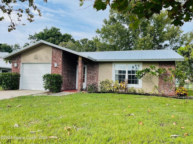 ranch-style home featuring a front lawn and a garage