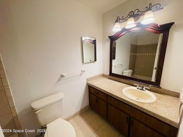 bathroom with tile patterned floors, walk in shower, vanity, and toilet