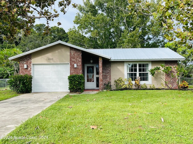 ranch-style home featuring a front yard and a garage