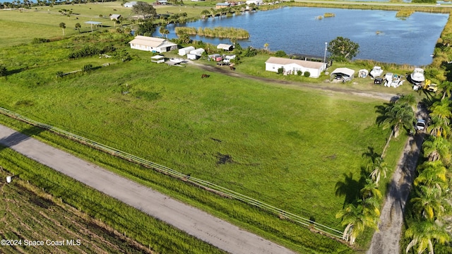 drone / aerial view featuring a rural view and a water view