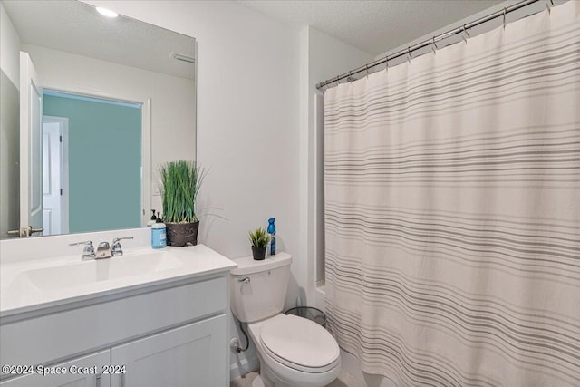1447 Colebrook Cir SW, Palm Bay, FL 32908 - full bath featuring vanity, toilet, shower / bath combo with shower curtain, and a textured ceiling