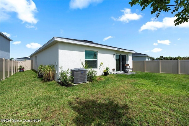1447 Colebrook Cir SW, Palm Bay, FL 32908 - rear view of house featuring stucco siding and cooling unit