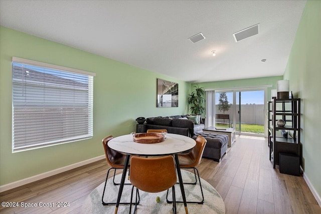 1447 Colebrook Cir SW, Palm Bay, FL 32908 - dining space featuring wood finished floors and baseboards