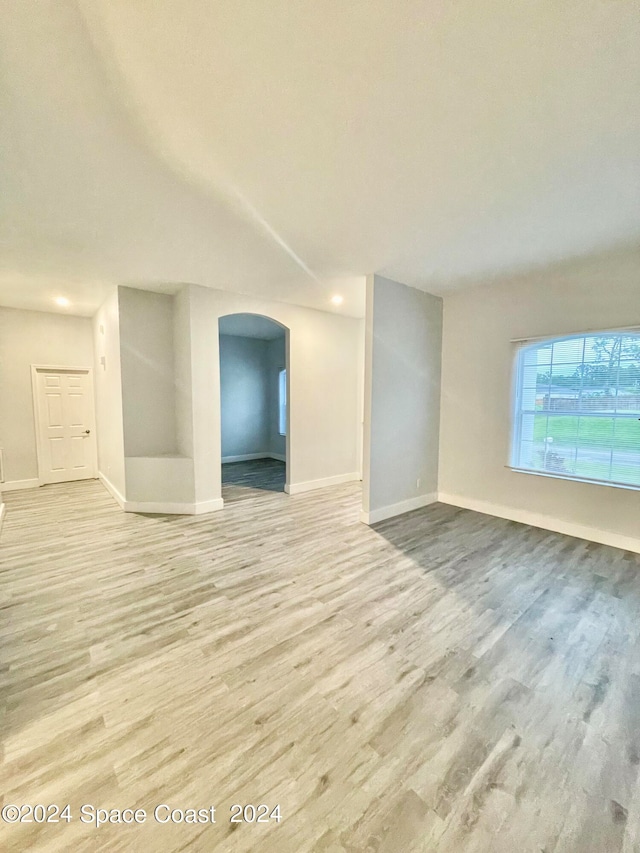 unfurnished living room with light hardwood / wood-style flooring