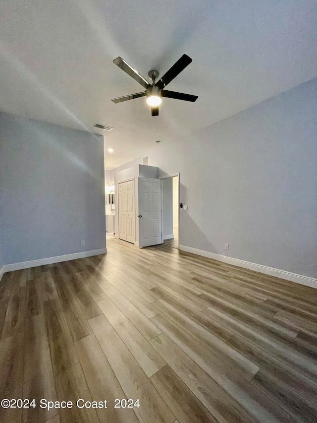 unfurnished room with ceiling fan and hardwood / wood-style floors