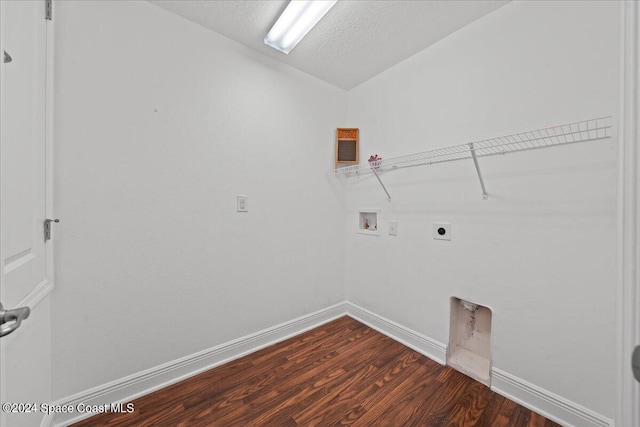 clothes washing area featuring hookup for an electric dryer, hookup for a washing machine, a textured ceiling, and dark hardwood / wood-style floors