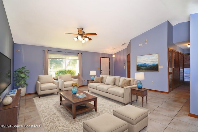 tiled living room with ceiling fan and lofted ceiling