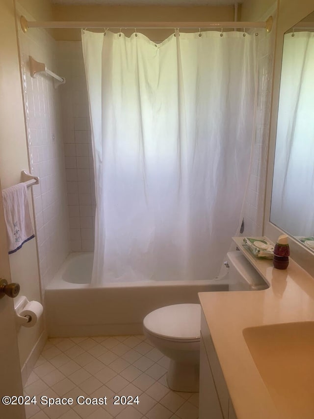 full bathroom featuring vanity, tile patterned flooring, toilet, and shower / bathtub combination with curtain