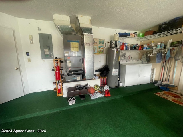 garage with electric panel, washer and dryer, and electric water heater