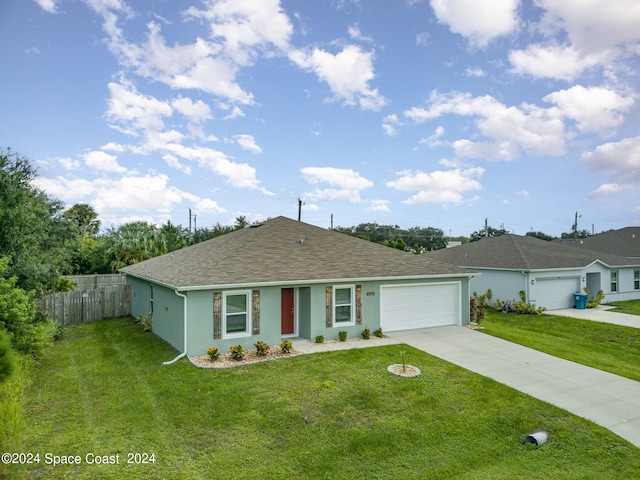 single story home with a front yard and a garage