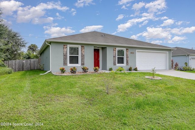 ranch-style home with a garage and a front lawn