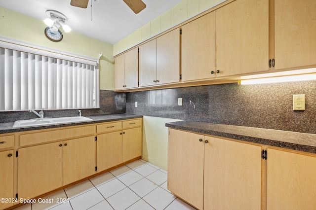 kitchen featuring sink, decorative backsplash, light brown cabinets, light tile patterned floors, and ceiling fan