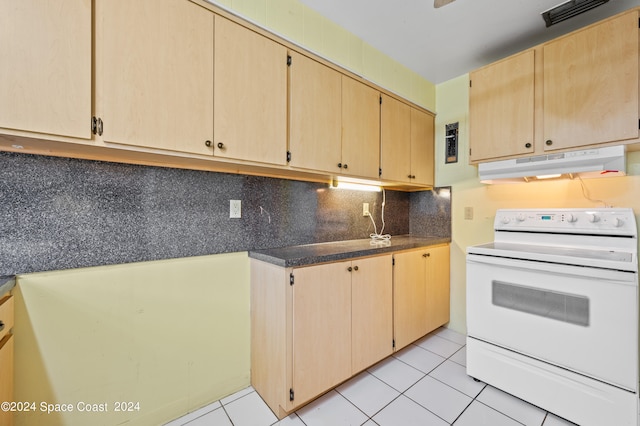 kitchen with light brown cabinetry, light tile patterned flooring, white electric range oven, and tasteful backsplash