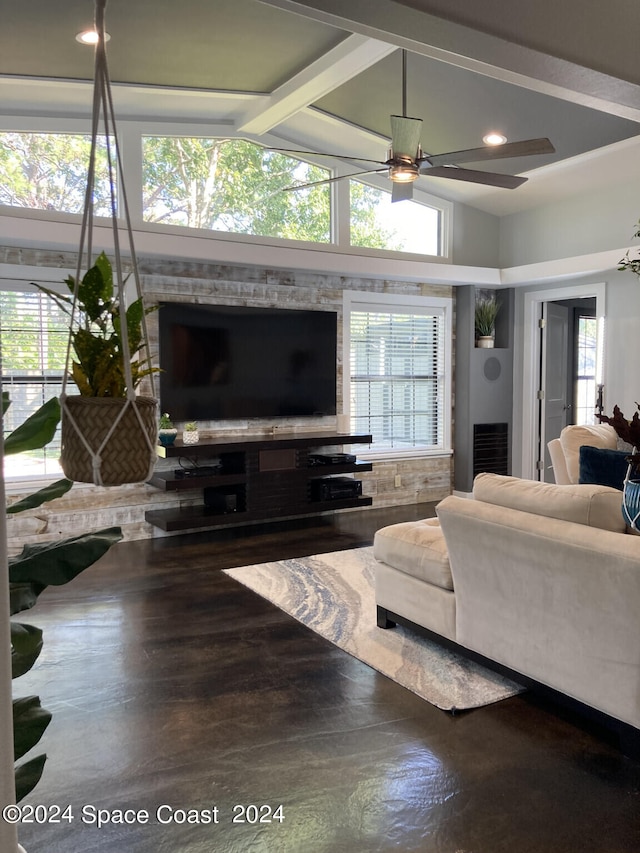 living room featuring ceiling fan, beamed ceiling, hardwood / wood-style flooring, and plenty of natural light