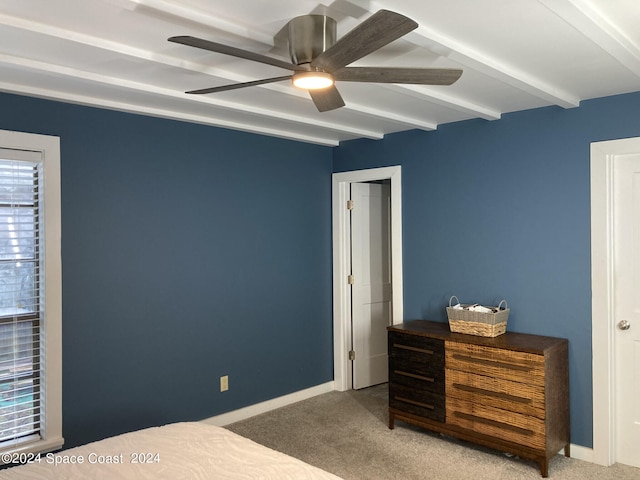 carpeted bedroom with beam ceiling and ceiling fan