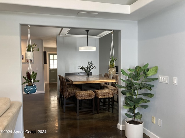 dining area featuring dark wood-type flooring