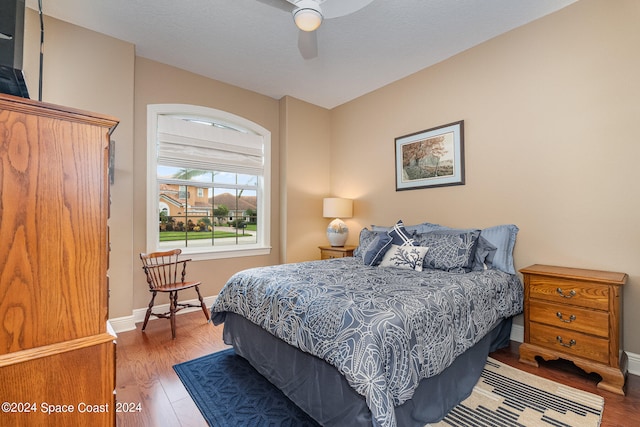 bedroom featuring ceiling fan and hardwood / wood-style flooring