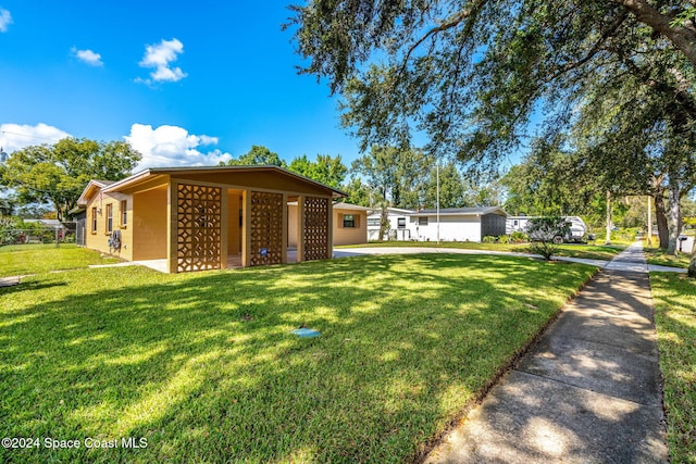 2415 Stanford Dr, Cocoa, FL 32926 - view of green lawn featuring mail area