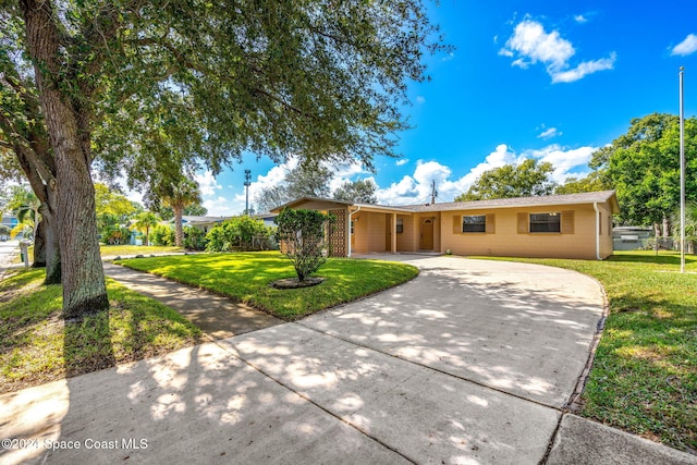 ranch-style house with a front lawn