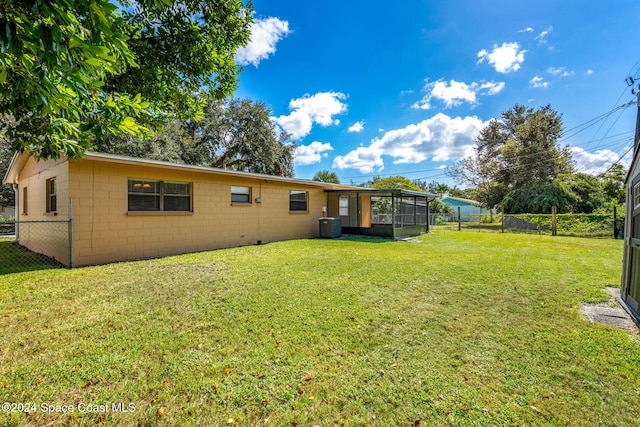 2415 Stanford Dr, Cocoa, FL 32926 - view of yard with a sunroom and cooling unit