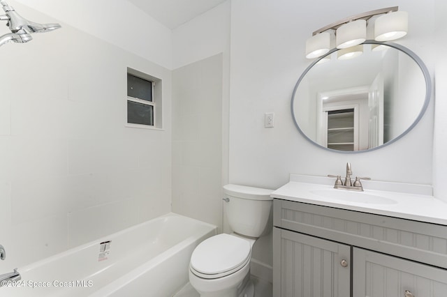 full bathroom featuring vanity, toilet, and tiled shower / bath