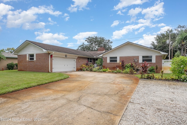 single story home featuring a front yard and a garage