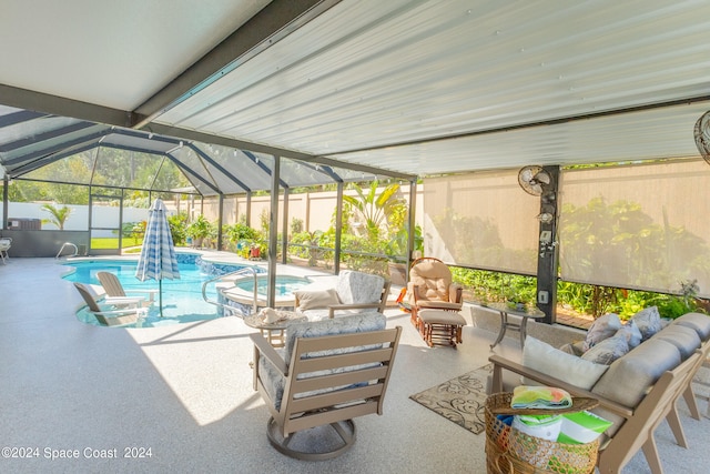 view of patio / terrace featuring outdoor lounge area, a fenced in pool, and glass enclosure