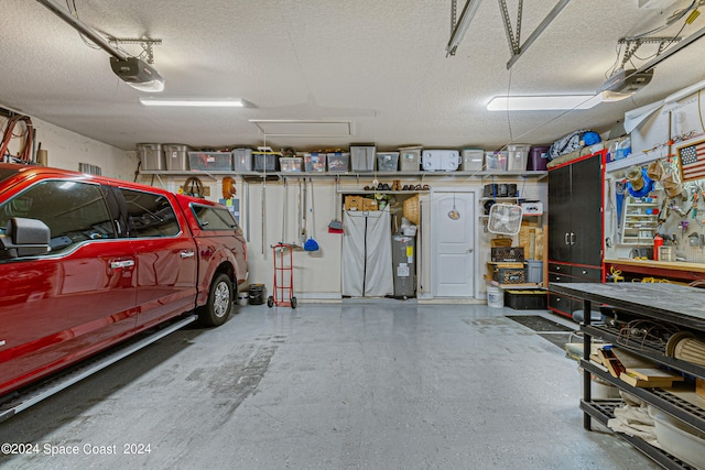 garage with a garage door opener and a workshop area