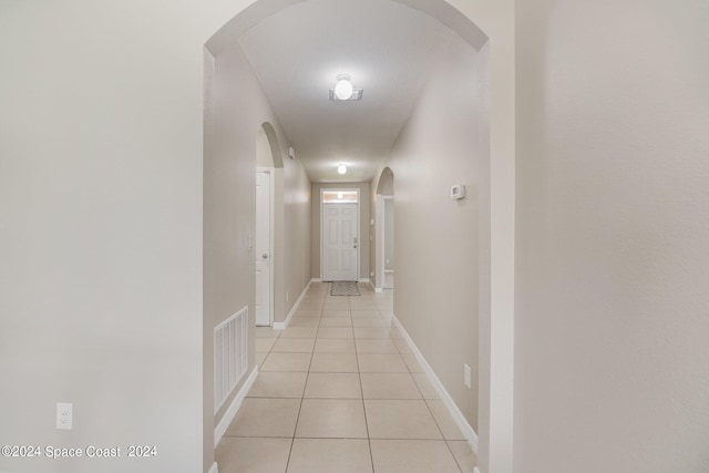 corridor with light tile patterned floors