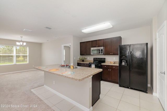 kitchen with an island with sink, a chandelier, black appliances, sink, and light colored carpet