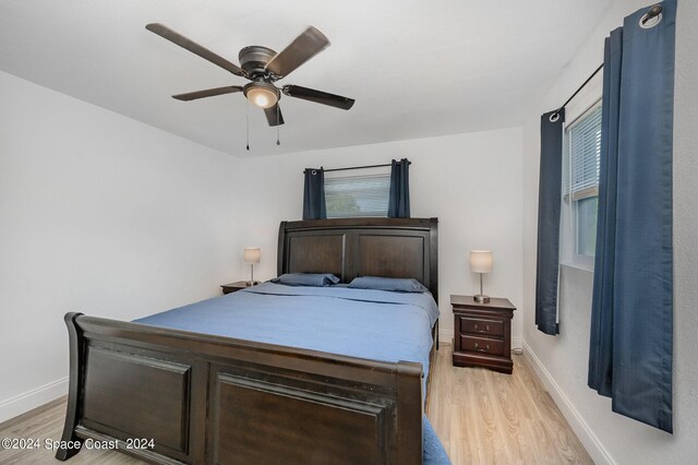 bedroom featuring ceiling fan and light hardwood / wood-style flooring