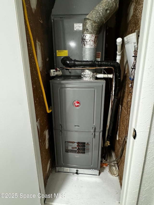 utility room with heating unit