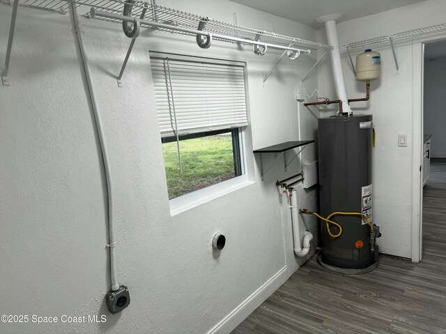 utility room with water heater