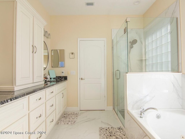 bathroom featuring independent shower and bath and vanity