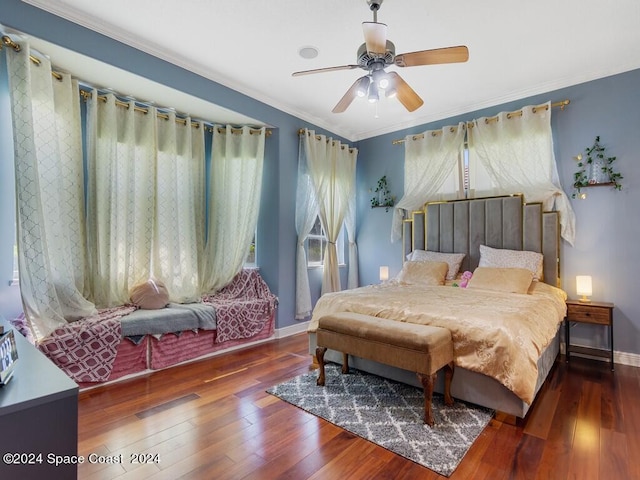 bedroom with ceiling fan, crown molding, and dark wood-type flooring