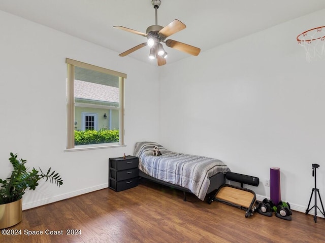 bedroom with dark wood-type flooring and ceiling fan