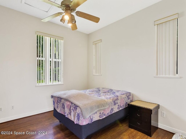 bedroom with ceiling fan and dark wood-type flooring