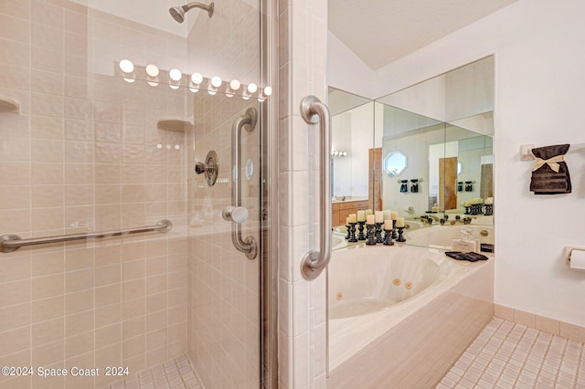 bathroom featuring separate shower and tub, tile patterned floors, and vaulted ceiling