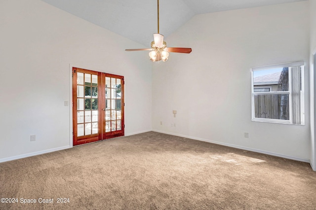 spare room with ceiling fan, french doors, carpet, and high vaulted ceiling