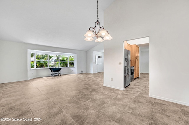 unfurnished living room featuring a chandelier and lofted ceiling