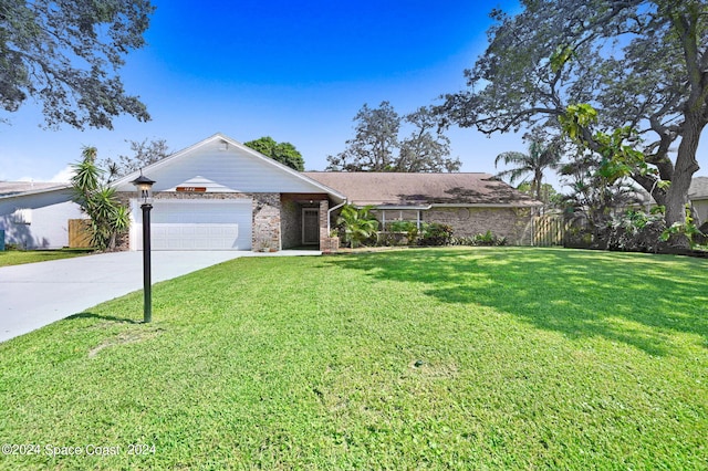 ranch-style house with a garage and a front lawn